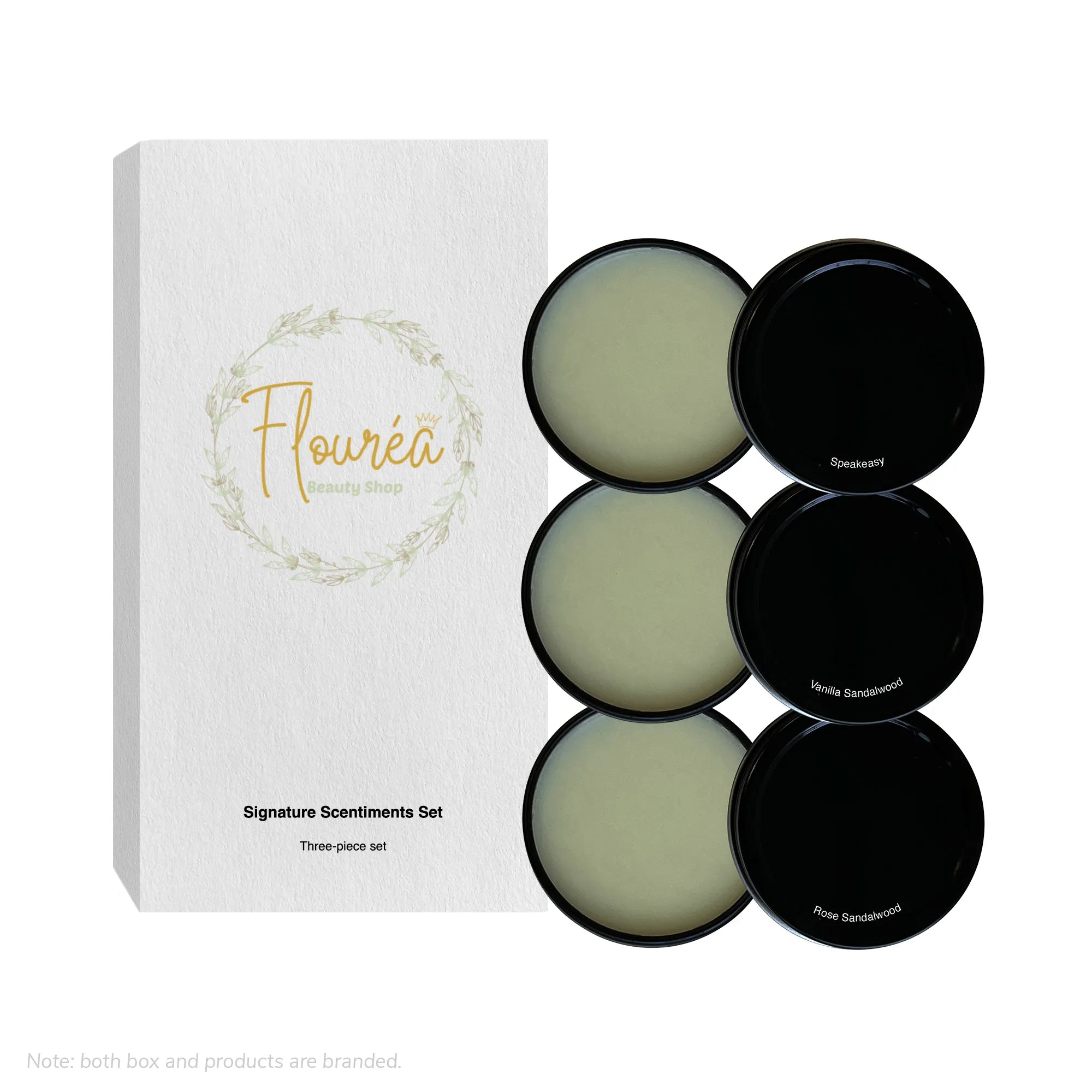 White Flourea Signature Scentiments Set box displayed next to three open black tins containing solid perfume.